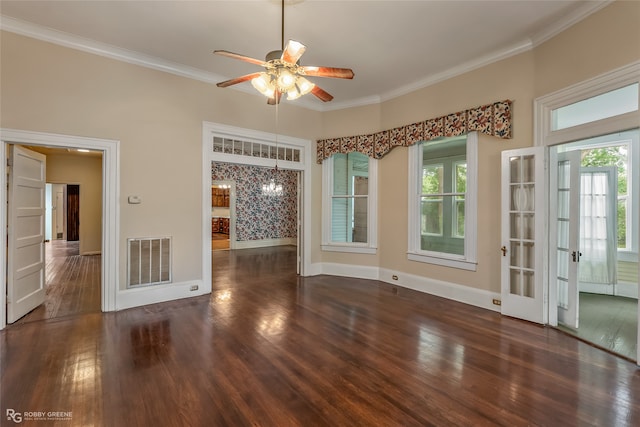 interior space featuring plenty of natural light, ceiling fan, ornamental molding, and dark wood-type flooring