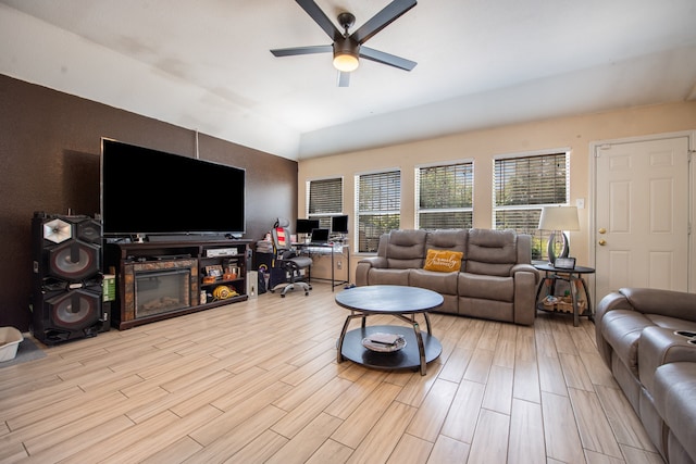 living room with ceiling fan and light wood-type flooring