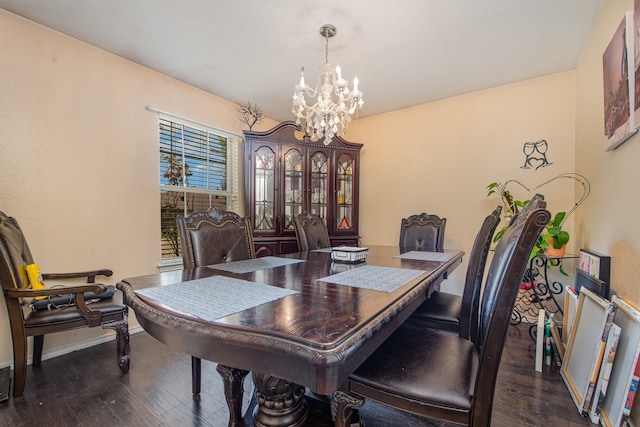 dining room featuring a notable chandelier and dark wood-type flooring