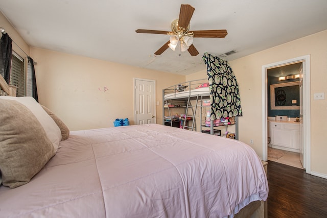 bedroom featuring ceiling fan, connected bathroom, and hardwood / wood-style floors