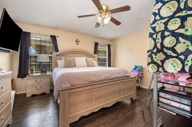 bedroom featuring ceiling fan and dark hardwood / wood-style floors