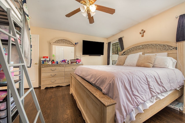 bedroom with ceiling fan and dark wood-type flooring