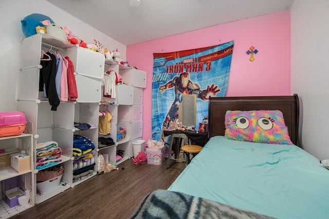 bedroom with hardwood / wood-style flooring