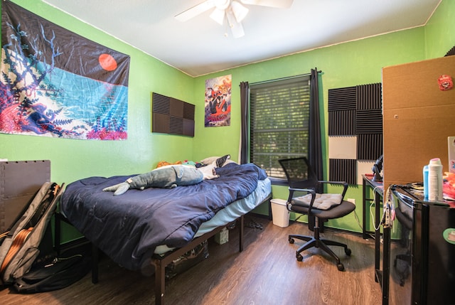 bedroom featuring hardwood / wood-style flooring and ceiling fan