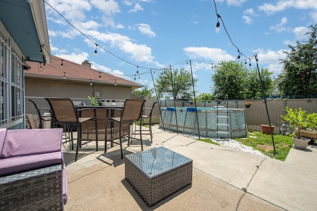 view of patio with a fenced in pool