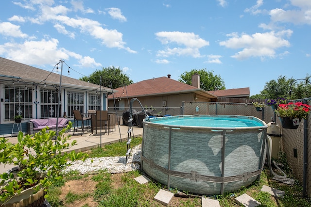 view of swimming pool with a patio