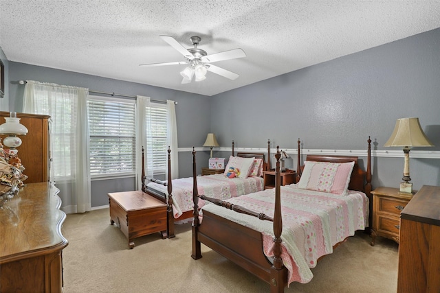 bedroom with access to exterior, ceiling fan, light carpet, and a textured ceiling