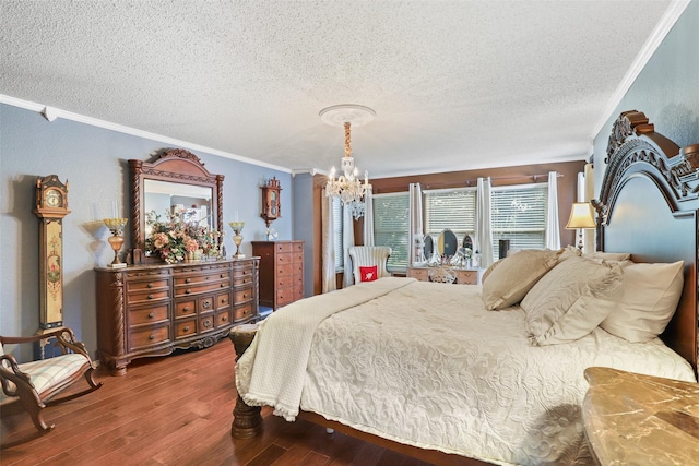 bedroom featuring wood-type flooring, a textured ceiling, an inviting chandelier, and ornamental molding