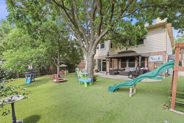 view of jungle gym with outdoor lounge area, a gazebo, a trampoline, and a yard