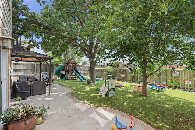 view of yard with a playground and a patio area