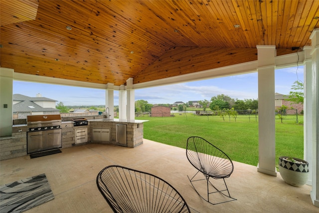 view of terrace featuring sink, exterior kitchen, and grilling area