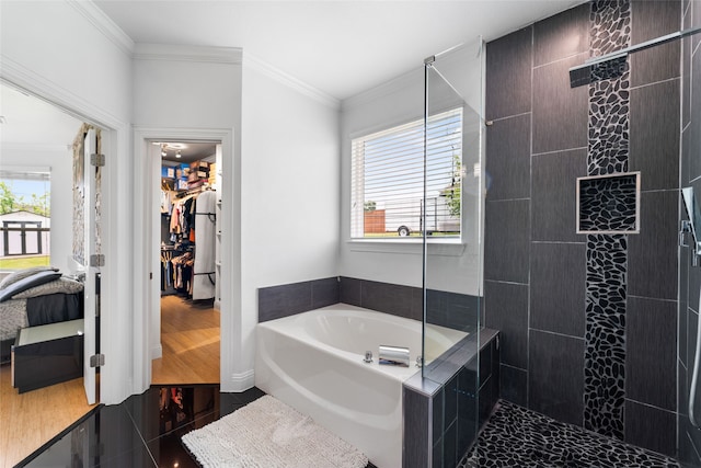 bathroom featuring independent shower and bath, hardwood / wood-style flooring, and crown molding