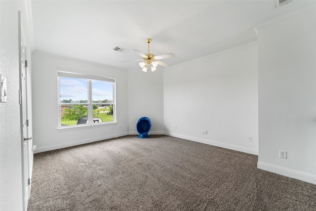 carpeted empty room featuring ornamental molding and ceiling fan