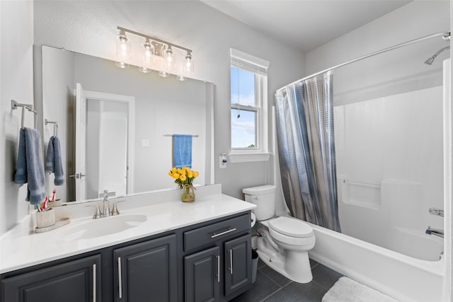 full bathroom with tile floors, vanity with extensive cabinet space, toilet, and shower / bath combo with shower curtain