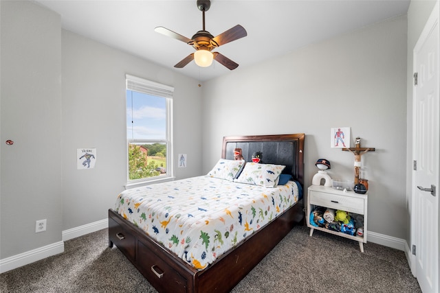 bedroom with ceiling fan and dark colored carpet