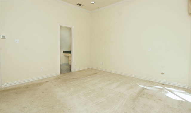 carpeted spare room featuring ornamental molding