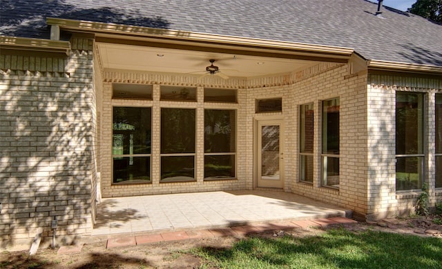 doorway to property featuring a patio and ceiling fan