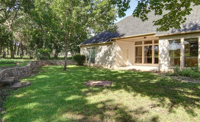 view of yard featuring ceiling fan