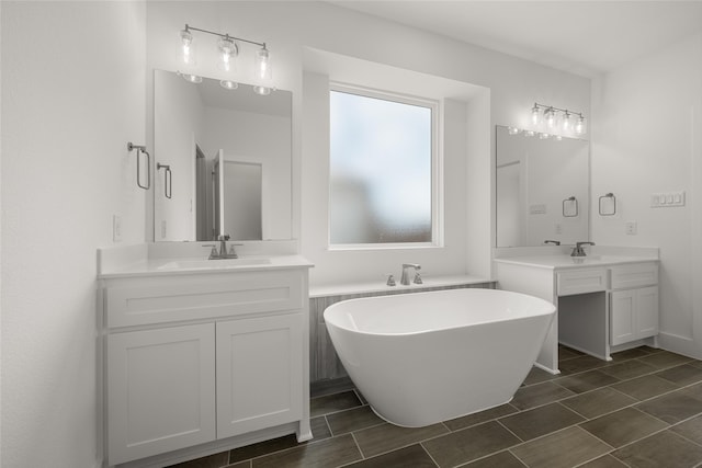 bathroom featuring dual vanity, a bath, and tile patterned floors