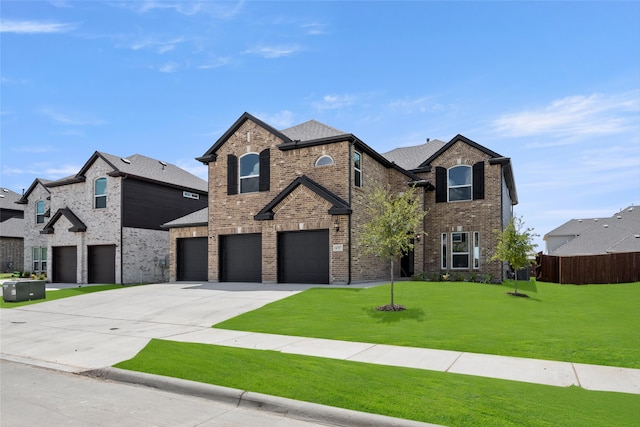 view of front of home featuring a front lawn and a garage