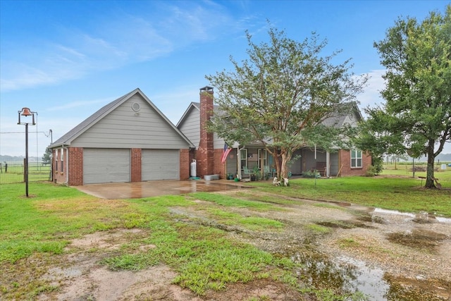 view of front facade with a garage and a front lawn