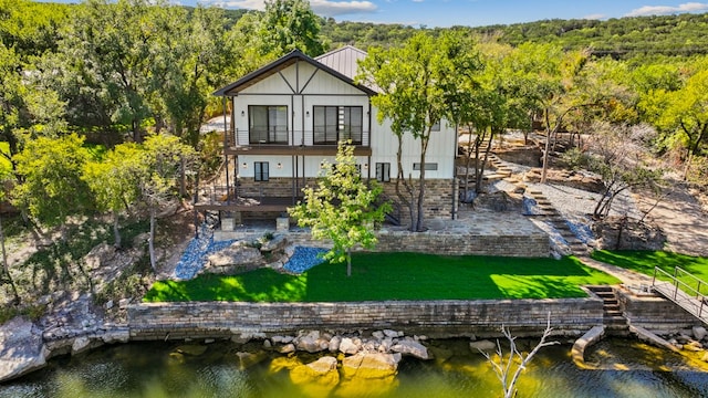 rear view of house with a water view