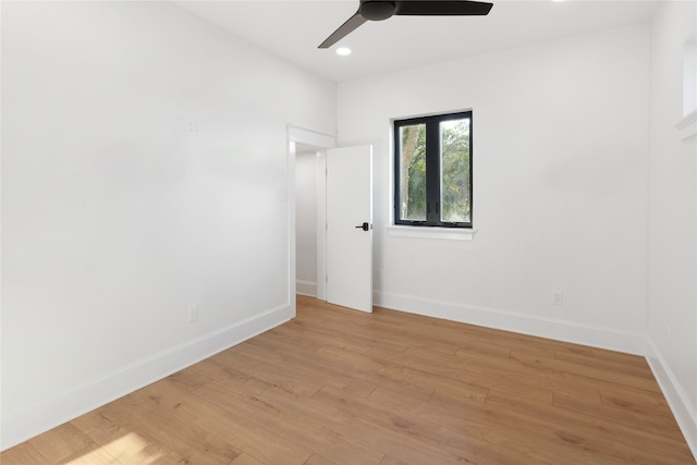 unfurnished room featuring light hardwood / wood-style flooring and ceiling fan