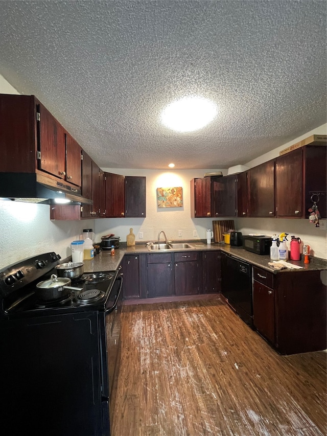 kitchen with dark brown cabinets, black appliances, dark wood-type flooring, a textured ceiling, and sink