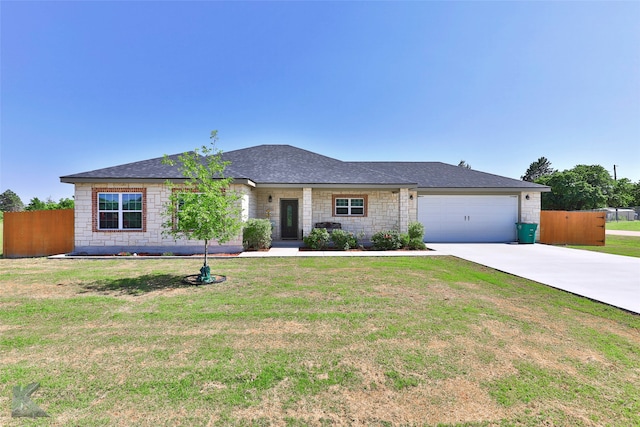 single story home featuring a front lawn and a garage