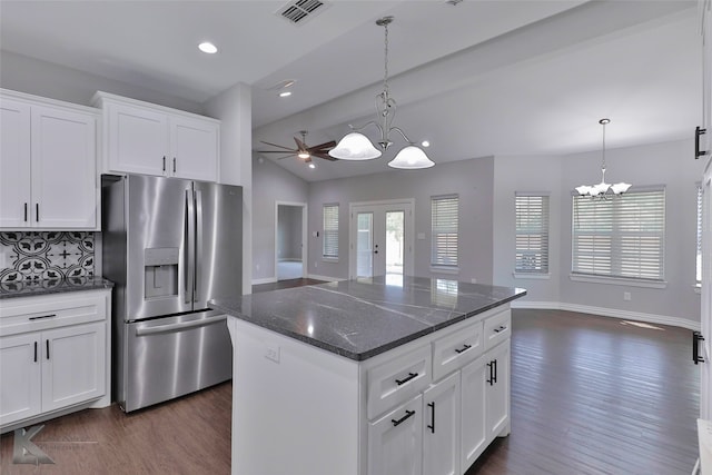 kitchen with vaulted ceiling, dark hardwood / wood-style flooring, stainless steel fridge with ice dispenser, tasteful backsplash, and a center island