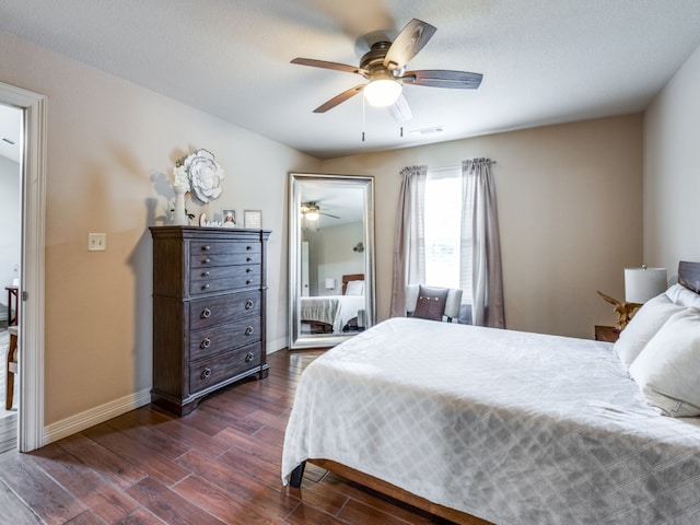 bedroom featuring dark hardwood / wood-style floors and ceiling fan