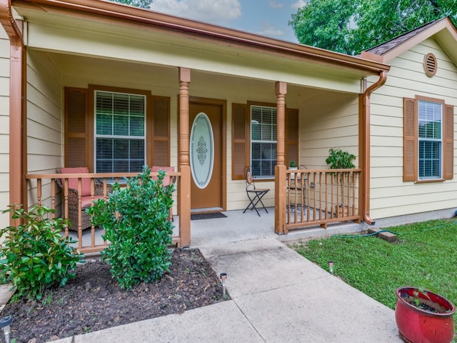 property entrance with covered porch