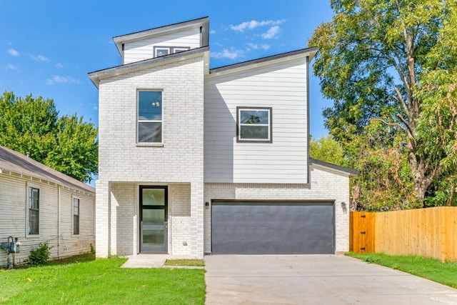 modern home with a front lawn and a garage