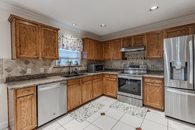 kitchen featuring stainless steel appliances, light tile patterned flooring, sink, ornamental molding, and decorative backsplash