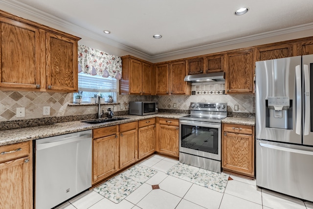 kitchen featuring tasteful backsplash, crown molding, stainless steel appliances, light tile patterned floors, and sink