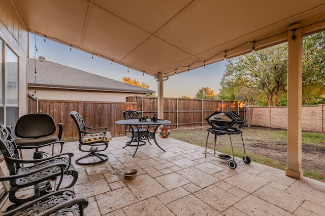 view of patio terrace at dusk