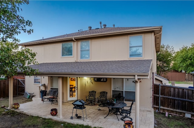 rear view of house with a patio