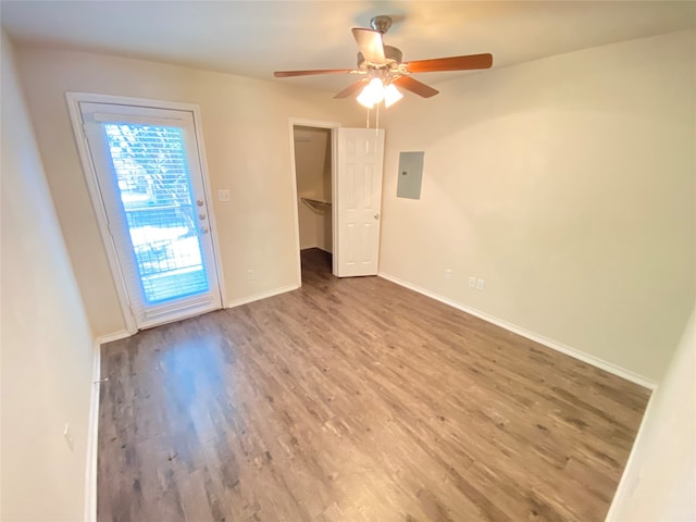 spare room featuring wood-type flooring and ceiling fan