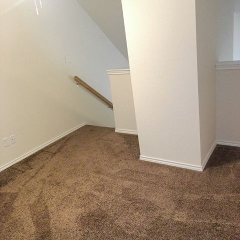 interior space featuring dark colored carpet