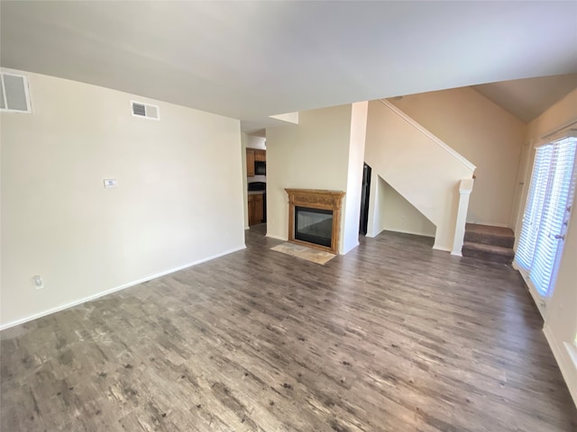 unfurnished living room featuring dark hardwood / wood-style floors