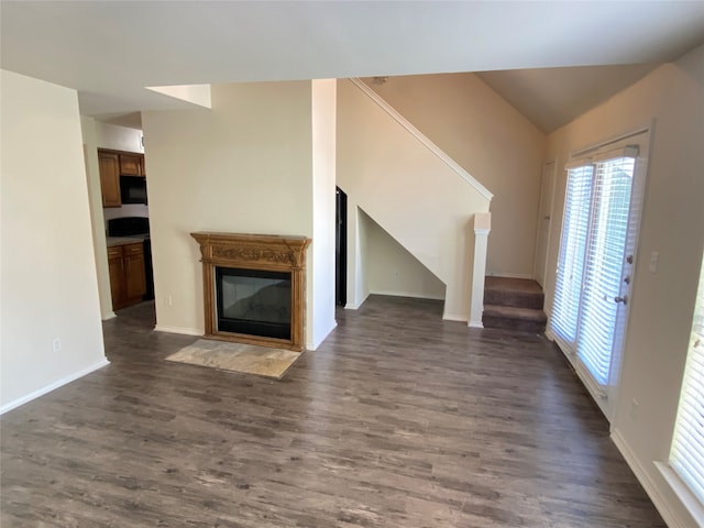 unfurnished living room with dark hardwood / wood-style flooring