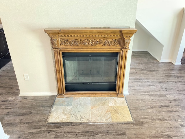 details featuring wood-type flooring and a fireplace