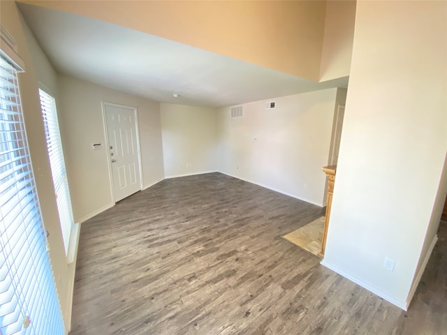 unfurnished room with wood-type flooring