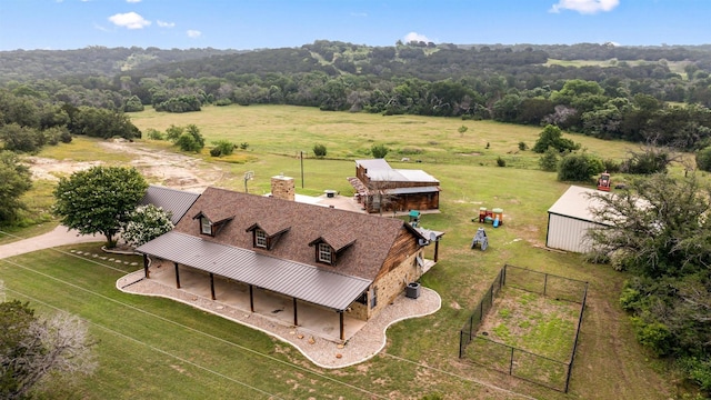 birds eye view of property with a rural view