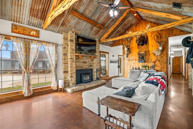 living room featuring wood walls, high vaulted ceiling, ceiling fan, concrete floors, and beamed ceiling