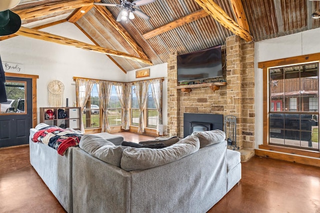 living room with high vaulted ceiling, a fireplace, beam ceiling, and finished concrete floors