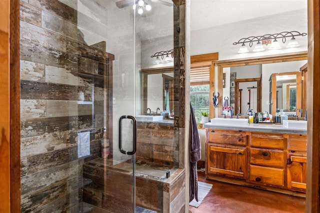 bathroom featuring vanity, ceiling fan, and an enclosed shower