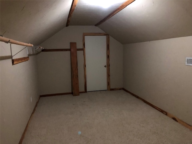 additional living space featuring lofted ceiling