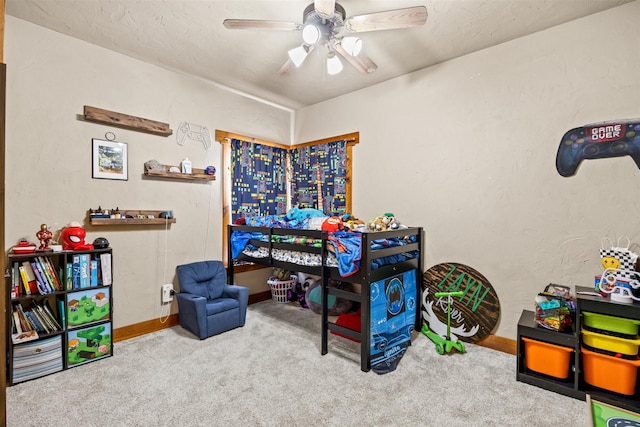 game room featuring light carpet and ceiling fan