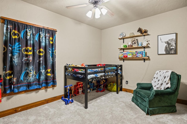 bedroom featuring a ceiling fan, baseboards, and carpet flooring